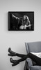 Bob Marley #7 by Richard E. Aaron | Classic Rock Photo | Limited Edition Print | 1978 at the New York Academy of Music in Brooklyn | Marley pointing, framed in black displayed near a reading chair.