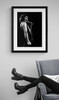 Queen # 12 | Freddie Mercury by Richard E. Aaron | Classic Rock Photo | Limited Edition Print | Framed in black and displayed by a reading chair.