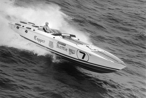 1970's fashion shoot on the water with speeding cigarette boat