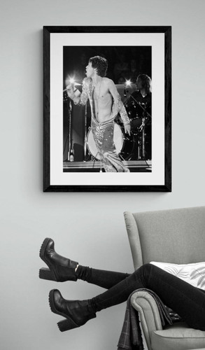 Mick Jagger | The Rolling Stones | Classic Rock Photo | Limited Edition Print framed near arm chair  by Jeffrey Mayer. Mick Jagger dancing with his outfit falling off.