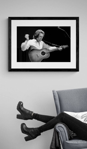 Neil Diamond by Richard E. Aaron | Classic Rock Photo | Limited Edition Print | Framed in black and displayed by a reading chair