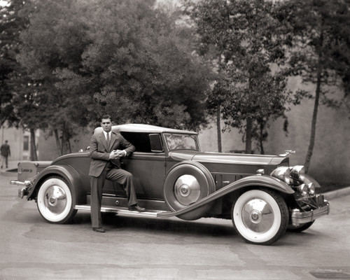 Clark Gable strikes a pose with his 1932 Packard Twin Six, Model # 905 V12.