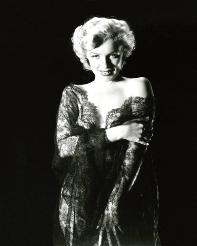 Great shot of Marilyn sexing it up a little in a black lace gown.