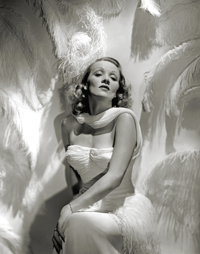 Stunning shot of Marlene Dietrich with white feathers by George Hurrell.