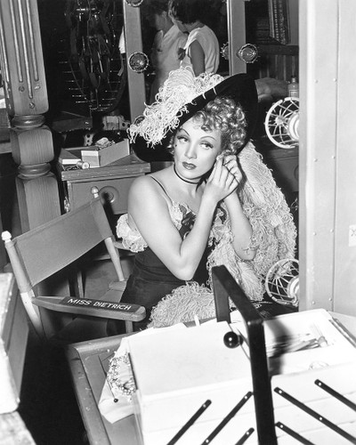 Marlene Dietrich Production Still. In this photograph we see Marlene getting ready for a scene in DESTRY RIDES AGAIN, her first role since becoming an American Citizen. She played opposite James Stewart in this 1939 Wild West melodrama.