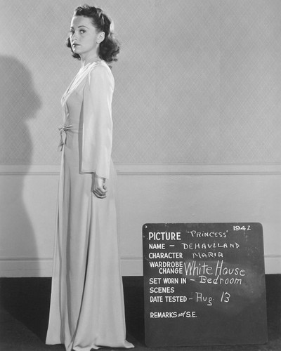 Wardrobe Test Shot of Olivia de Havilland in Princess O\'Rourke\nThis bright romantic comedy takes a shop-worn concept (opposites attract, royalty falling for a commoner) and executes it to near perfection. In fact, the Krasna screenplay took home an Oscar that year. Olivia enjoyed making the film and she bolsters it with a subtle, comic performance that showcased her versatility and craft. Five-time Oscar winner Orry-Kelley (1897-1964) is most closely linked to the career rise of Bette Davis (a life long friend) but he also gowned some of Hollywood’s most important leading ladies. He was a highly versatile designer working on everything from gangster dramas to Busby Berkeley Musicals.