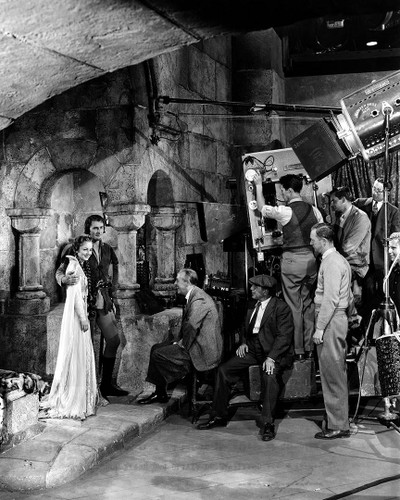 Production Still from The Adventures of Robin Hood, Warner Bros. 1938\nErrol Flynn was never braver and Olivia de Havilland never more beautiful. This is a glimpse of young actors engaged in the work that would make them true screen legends.
