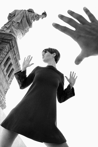 fashion model poses at Statue of Liberty