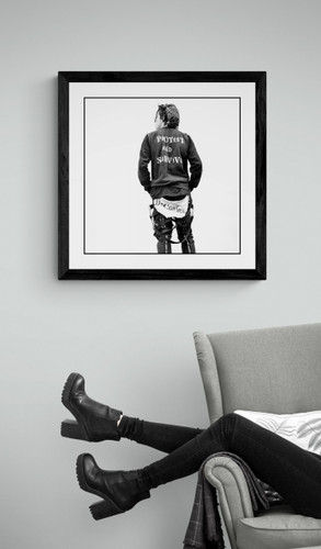 Protest & Survive by Drew Carolan | Vintage Punk Fashion Photo | Limited Edition Print framed in black and displayed near a reading chair.