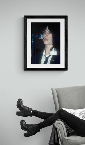 Patti Smith photo by Jeffrey Mayer framed in black by arm chair
