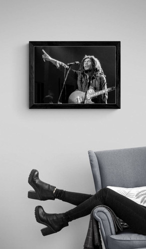 Bob Marley #7 by Richard E. Aaron | Classic Rock Photo | Limited Edition Print | 1978 at the New York Academy of Music in Brooklyn | Marley pointing, framed in black displayed near a reading chair.