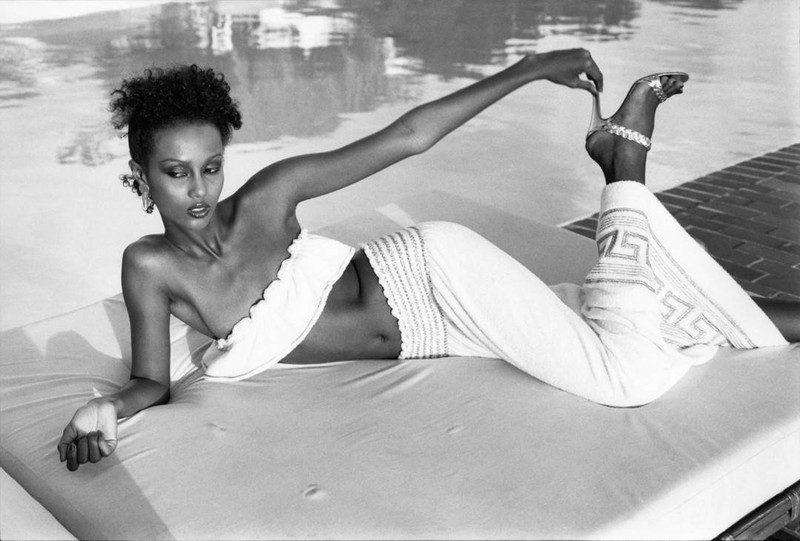 Super model Iman lounging at the pool