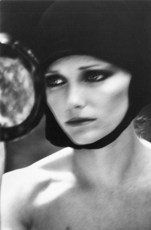 1970\'s fashion shoot with super model Cheryl Tiegs looking in the mirror