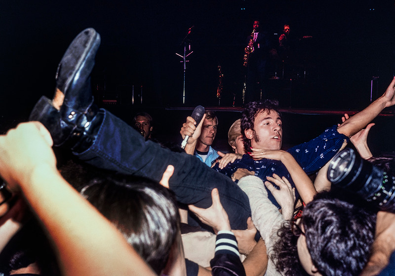 Bruce Springsteen jumps from the stage and is carried by the crowd in this fine art rock and roll photograph by Jeffrey Mayer printed at  FATHOM .