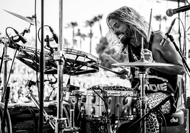 Concert photograph of Taylor Hawkins playing drums at The Beach Life Festival in California.