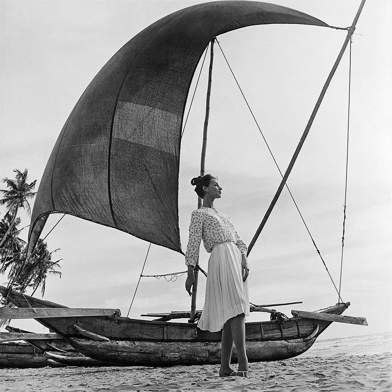 Ceylon Sails by Gleb Derujinsky | Vintage Fashion Photo | Fashion shot of a woman on the beach near a Sailboat