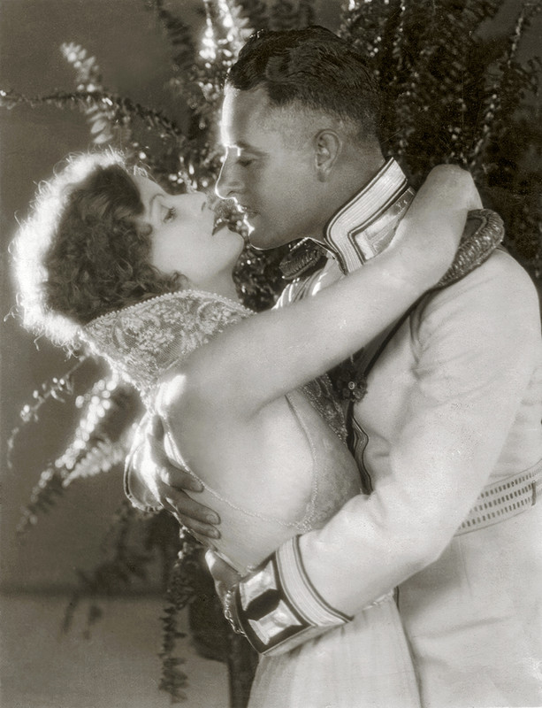 Greta Garbo and John Gilbert in a romantic embrace by Ruth Harriet Louise, Love, 1927