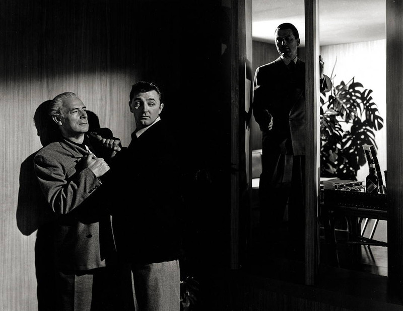 Dramatic, moody, scene still of Robert Mitchum, Charles McGraw, His Kind of Woman, 1951