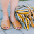 Female model wearing the Brave Soles sustainably made Avarca classic Spanish leather sandals with recycled tire soles in natural color