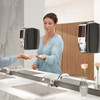 Lady in Washroom Uses Black Lumecel AutoFoam Dispenser to Administer  Free'N Clean Foam Soap