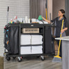 2202581 - Rubbermaid Full Size Housekeeping Cart - Cleaner Accessing Supplies on Fully Loaded Cart