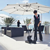 Female Cleaner Using Rubbermaid Lobby Pro Dust Pan to Tidy Outdoor Dining Area