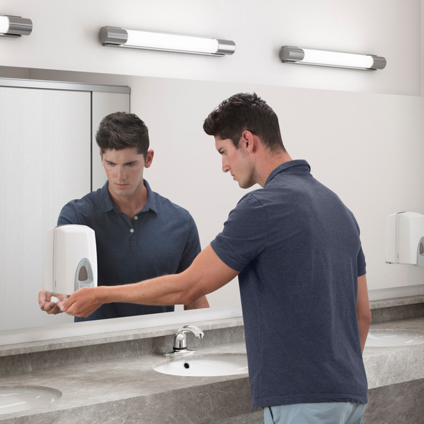 Man in Dark Blue T-shirt Uses 800ml Rubbermaid Unbranded Manual Foam Soap Dispenser in Washroom