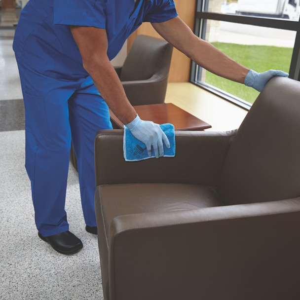Blue Rubbermaid HYGEN Microfibre Cloth Being Used to Wipe Down a Leather Chair