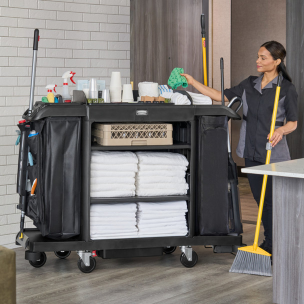 2202581 - Rubbermaid Full Size Housekeeping Cart - Cleaner Accessing Supplies on Fully Loaded Cart