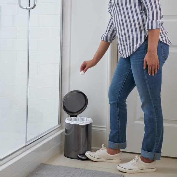 Rubbermaid Round Pedal-Operated Wastebasket with Liner Installed & Being Used by a Lady to Discard Cotton Wool