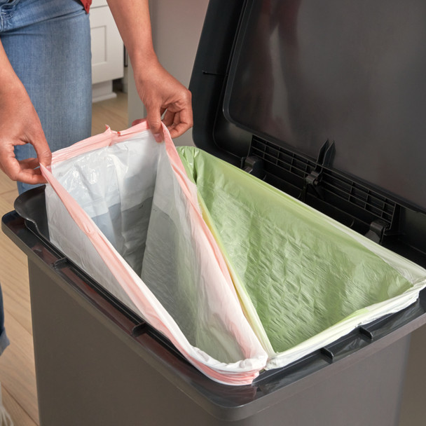 Lady Installs Bin Liners in Dual Stream Configuration