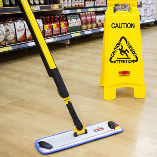 Rubbermaid HYGEN PULSE Mop Being Used to Clean Floor in Front of Wet Floor Sign Rubbermaid HYGEN PULSE Mop Being Used to Clean Floor in Front of Wet Floor Sign