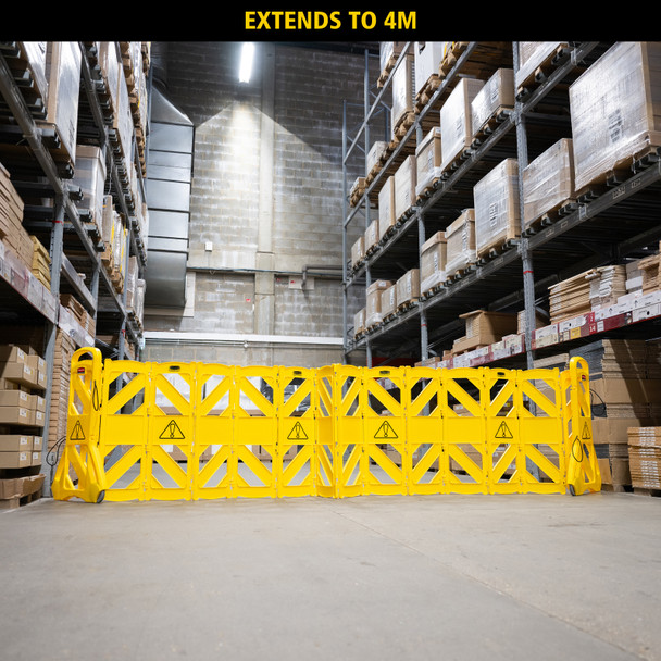 Rubbermaid FG9S1100YEL - Mobile Safety Barrier - Deployed in Warehouse