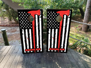 Custom firefighter-themed cornhole boards featuring a distressed black and white American flag with a bold red axe and personalized last name. Perfect for firefighter weddings, patriotic events, and first responder celebrations Custom firefighter-themed cornhole boards featuring a distressed black and white American flag with a bold red axe and personalized last name. Perfect for firefighter weddings, patriotic events, and first responder celebrations