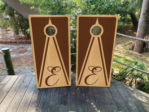 Custom wooden monogram triangle cornhole wraps featuring an elegant engraved-style letter 'E' design with a natural wood finish. Perfect for weddings, anniversaries, and personalized gifts. Custom wooden monogram triangle cornhole wraps featuring an elegant engraved-style letter 'E' design with a natural wood finish. Perfect for weddings, anniversaries, and personalized gifts.
