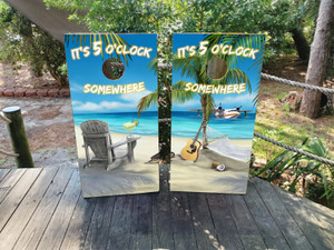These cornhole wraps feature a relaxing tropical beach theme with the phrase "It's 5 O'clock Somewhere" displayed at the top. One side shows a beach scene with a wooden chair, a margarita on the armrest, and a palm tree shading the view of the ocean. The other wrap has a hammock strung between palm trees, with a guitar and a seaplane in the background, completing the laid-back island vibe. The bright blue skies, sandy beach, and tranquil setting create a perfect getaway atmosphere, ideal for those who enjoy leisure, music, and the beach life. These cornhole wraps feature a relaxing tropical beach theme with the phrase "It's 5 O'clock Somewhere" displayed at the top. One side shows a beach scene with a wooden chair, a margarita on the armrest, and a palm tree shading the view of the ocean. The other wrap has a hammock strung between palm trees, with a guitar and a seaplane in the background, completing the laid-back island vibe. The bright blue skies, sandy beach, and tranquil setting create a perfect getaway atmosphere, ideal for those who enjoy leisure, music, and the beach life.