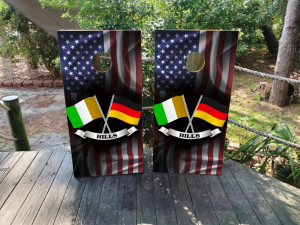 Custom cornhole wraps featuring an American flag background with crossed Irish and German flags and a personalized "Hills" name banner. Custom cornhole wraps featuring an American flag background with crossed Irish and German flags and a personalized "Hills" name banner.
