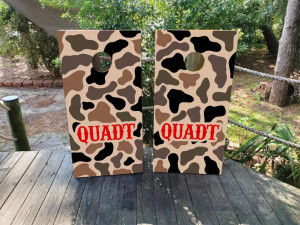 Camouflage-themed cornhole board wraps with a rugged hunting-inspired design. Featuring earthy brown, black, and tan camo patterns with bold red text, these wraps are perfect for outdoor enthusiasts, hunting camps, and rustic game setups. Durable, weatherproof, and easy to apply Camouflage-themed cornhole board wraps with a rugged hunting-inspired design. Featuring earthy brown, black, and tan camo patterns with bold red text, these wraps are perfect for outdoor enthusiasts, hunting camps, and rustic game setups. Durable, weatherproof, and easy to apply