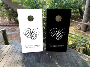 Elegant black and white wedding cornhole board wraps featuring a large intertwined script monogram “W & C” and personalized text reading “Whitney & Chance – October 25, 2025.” A timeless, high-contrast design perfect for formal weddings, classic receptions, or black-tie celebrations.