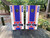 Custom sports team cornhole boards featuring a bold red, white, and blue design with a customizable team logo and text. Perfect for tailgates, game days, and sports fans
