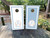 Elegant monogram wedding cornhole board wraps in dusty blue and white, featuring a refined crest design with initials “A & B,” family name “The Devines,” and wedding date “10.17.2025.” These sophisticated vinyl wraps include a laurel wreath motif and classic border detailing—perfect for timeless, romantic wedding décor.