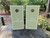 Sage green cornhole wraps with a solid design and a striped design