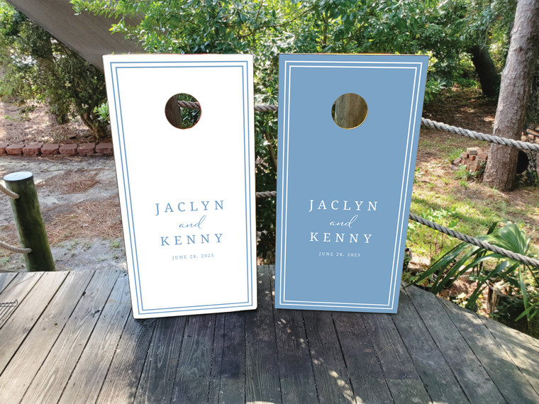 Elegant powder blue and white wedding cornhole board wraps featuring clean double-line borders and personalized text reading “Jaclyn and Kenny – June 28, 2025.” The modern minimalist design combines classic wedding style with soft, romantic tones—perfect for outdoor receptions and summer celebrations.