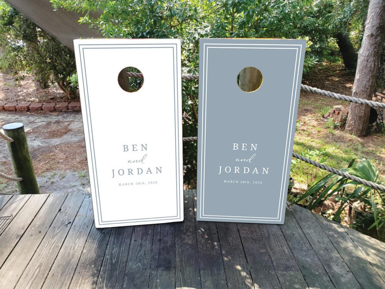 Elegant Dusty blue and white wedding cornhole board wraps featuring clean double-line borders and personalized text r