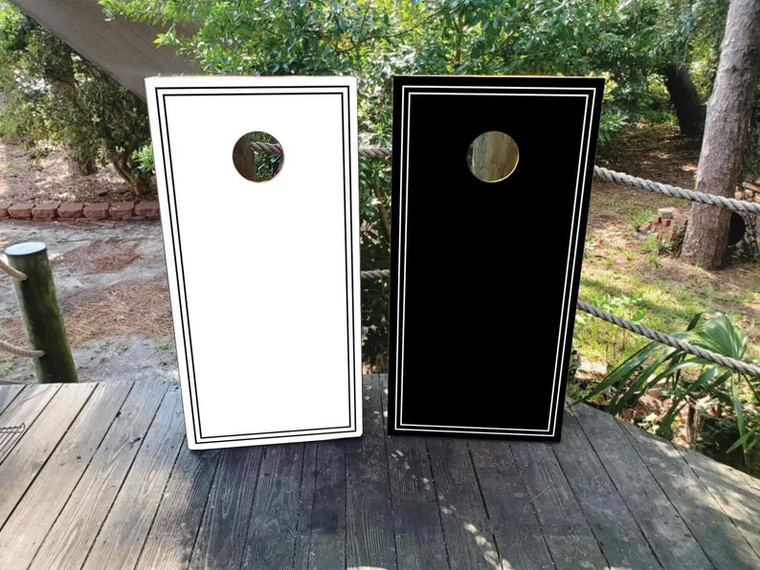 "Elegant black and white Mr. and Mrs. wedding cornhole boards featuring a minimalist design with bold script lettering. Perfect for wedding receptions, bridal showers, and anniversary celebrations."