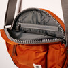 Paddington Round Nylon Crossbody Bag in Burnt Orange