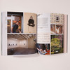 "Noah Davis" open to a two-page spread showing a collage of images depicting Noah Davis himself, typed and handwritten letters, inspirational photographs, and finished works of art on display in gallery spaces.
