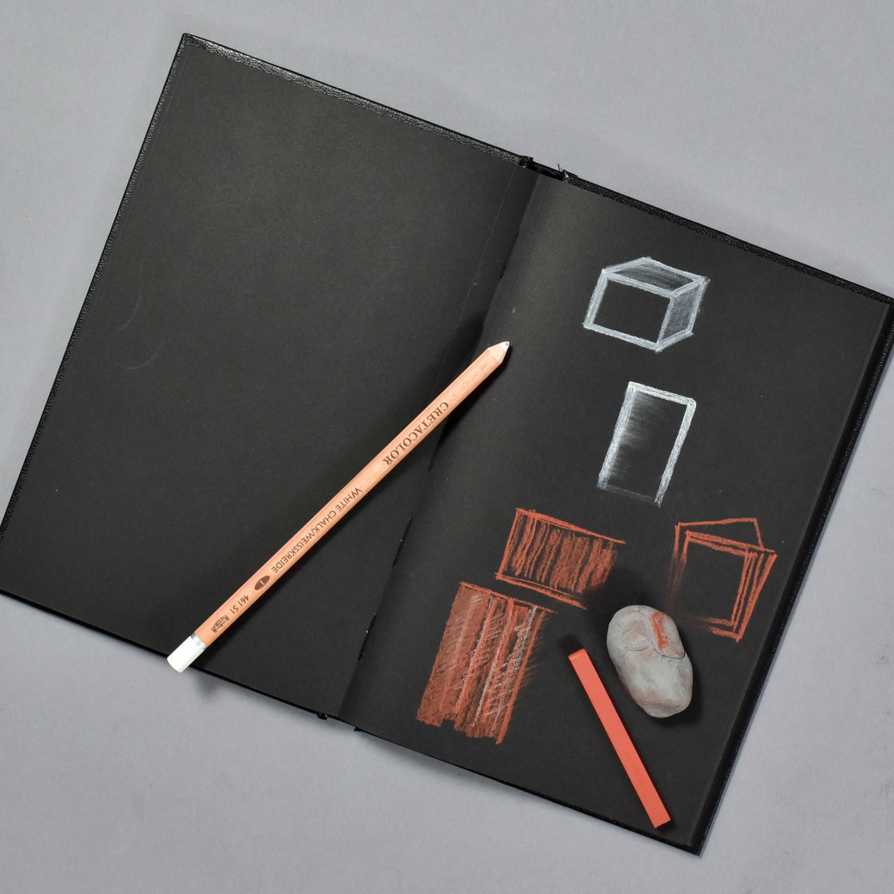 Open Blank Sketch Book With Chalk Colored And Colour Pencils Stock