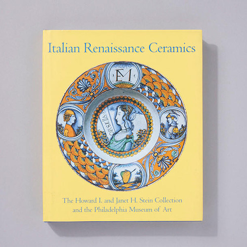 Front cover of Italian Renaissance Ceramics depicting an orange and blue ceramic dish. In the center of the dish, a woman looks to the left in profile flanked on either side by men in profile looking toward her.