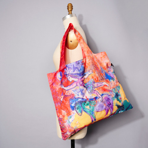 Full bleed image of Chagall's 'The Circus' printed on a tote bag shown on dress form's shoulder for scale and usage suggestion.